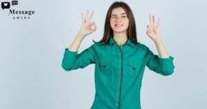 A young woman in a green button-up shirt winking and showing the OK hand sign with both hands, perfectly illustrating smart ways to respond to an OK text.