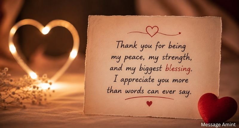 Deep love messages for her with an appreciation quote on a romantic card and heart-shaped lights.