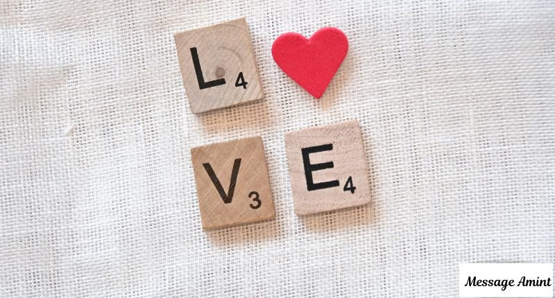 Wooden letter tiles spelling out love with a red heart symbol, perfect for deep and heart touching messages that show what she truly means to you.