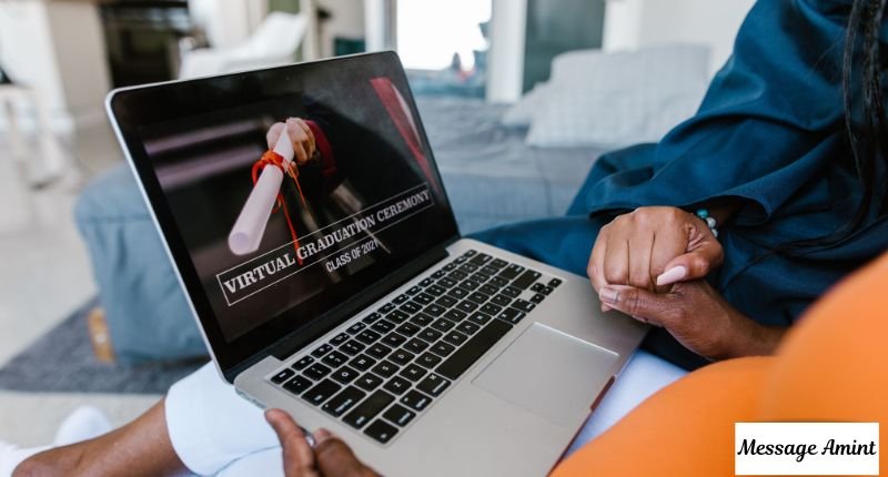 Woman watching virtual graduation ceremony on laptop for online degree