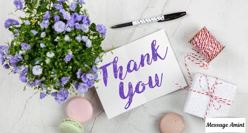 Graduation thank you card with flowers ribbon and wrapped gift