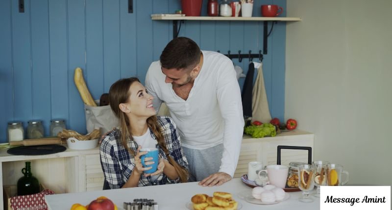 Warm affectionate morning moment shared between loved ones in kitchen